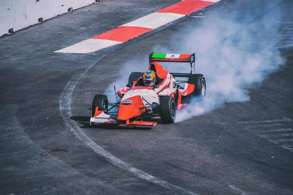 Action-packed Formula race car drifting on a track in Mexico City, vibrant and thrilling.