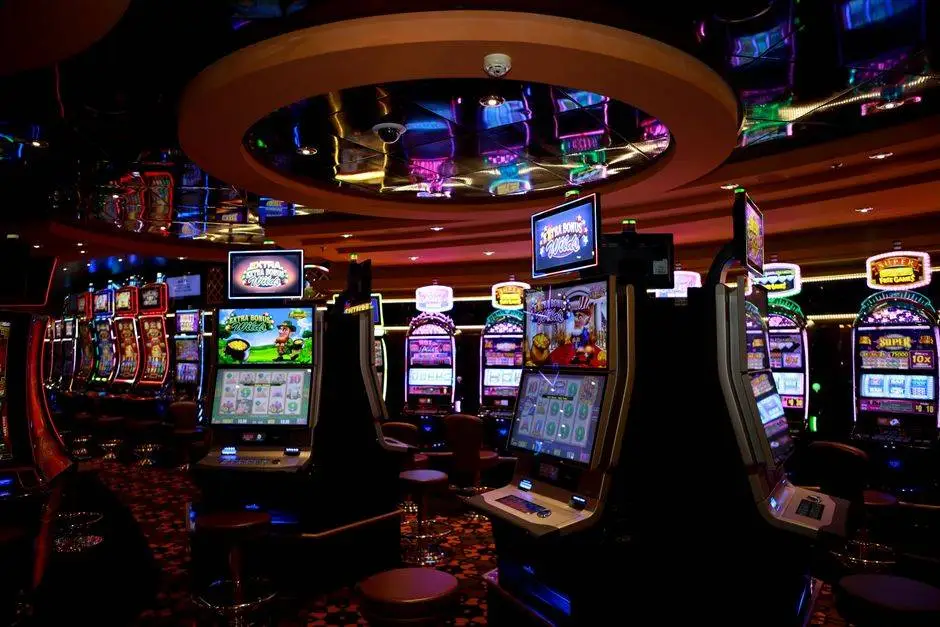 Vibrant casino floor with colorful slot machines and bright lights capturing a lively gaming atmosphere.
